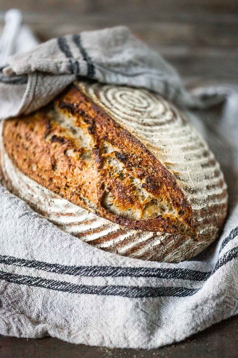 A loaf of no kneed sourdough bread, perfectly baked.