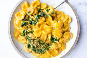 A simple delicious vegan recipe for Orecchiette Pasta with Creamy Carrot Miso Sauce, topped with Carrot Top Gremolata (optional) and Toasted Bread Crumbs. Flavorful and healthy! #orecchiette