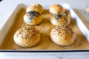 How to make Sourdough Buns with leftover over sourdough starter that are light and airy (like a brioche bun) in about 2 1/2 hours from start to finish, with only 20 minutes of hands-on time.
