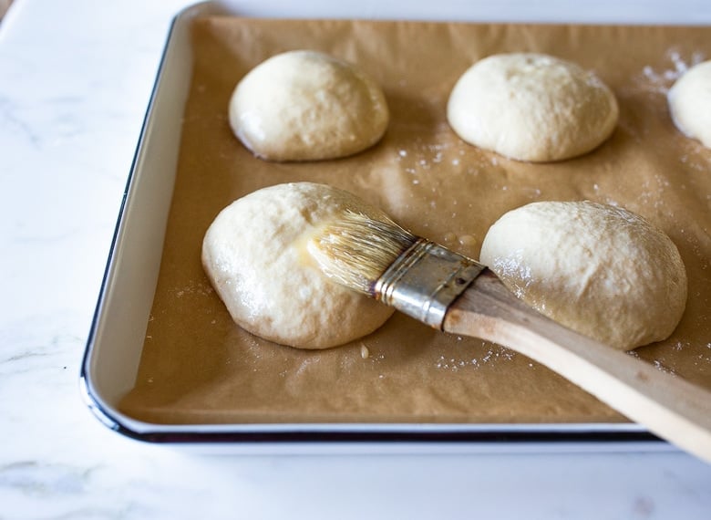 How to make Sourdough Buns with leftover over sourdough starter that are light and airy (like a brioche bun) in about 2 1/2 hours from start to finish, with only 20 minutes of hands-on time.