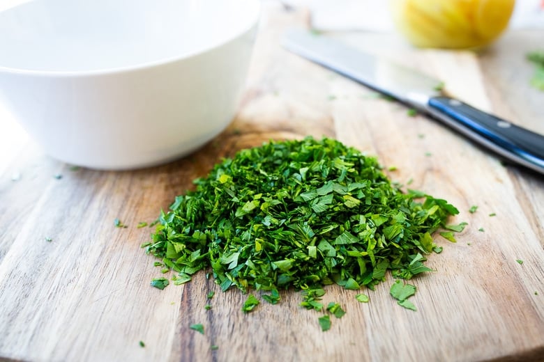 how to make Preserved Lemon Gremolata, an hearty zesty vegan condiment you'll want to put on everything! Delicious on grilled meats and fish, tossed with lentils, beans or pasta, or used as a dressing! #preservedlemon