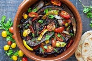 Slow-Baked Moroccan Eggplant with Ras el Hanout, caramelized garlic, shallots and tomatoes. A rustic side dish that can be turned into a hearty vegetarian main. Serve with Basmati Rice or homemade Pita, and Tzatziki Sauce. #eggplant #vegetariandinner