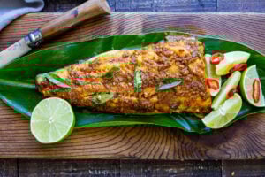 Here's a simple yet super flavorful recipe for Kerala-Style Fish, made with a flavorful paste that is either grilled or roasted in the oven. Curry leaves and Tamarind give this Indian Recipe its unique flavor. #kerala #keralafish #whitefish #indianrecipes
