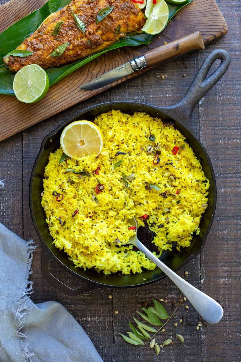 Kerala-Style Fish served with Lemon Rice. Curry leaves and Tamarind give this Indian Recipe its unique flavor. #kerala #keralafish #whitefish #indianrecipes