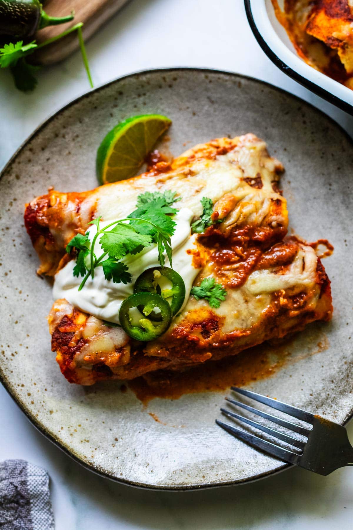 chicken enchiladas on a plate.