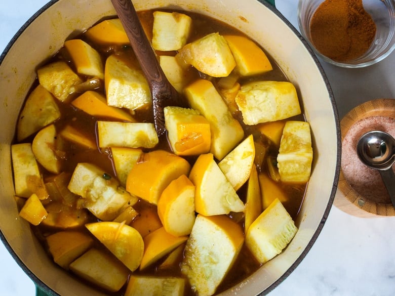 simmered summer squash in soup pot with broth. 