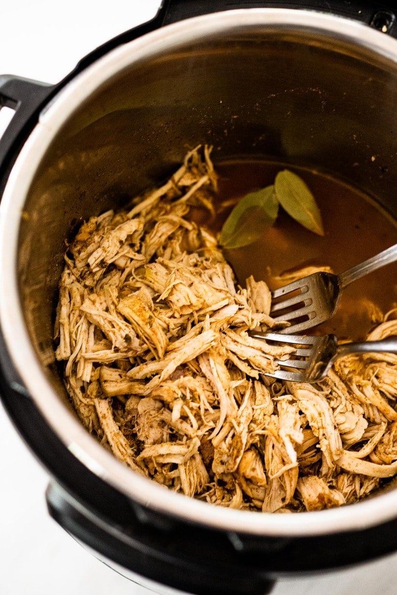 A simple easy recipe for Shredded chicken that can be made in an Instant Pot, Slow Cooker or on the Stovetop. Use breasts or thighs, fresh or frozen, great for meal prep and busy weeknight dinners. Keeps for 5 days in the fridge, or freeze! #shreddedchicken