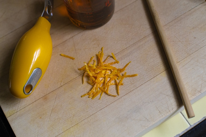 zesting the orange.