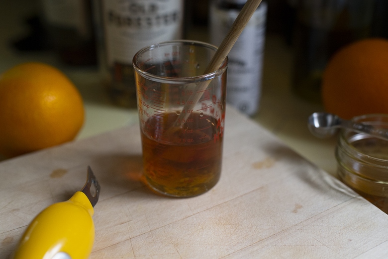Mixing the old fashioned cocktail. 