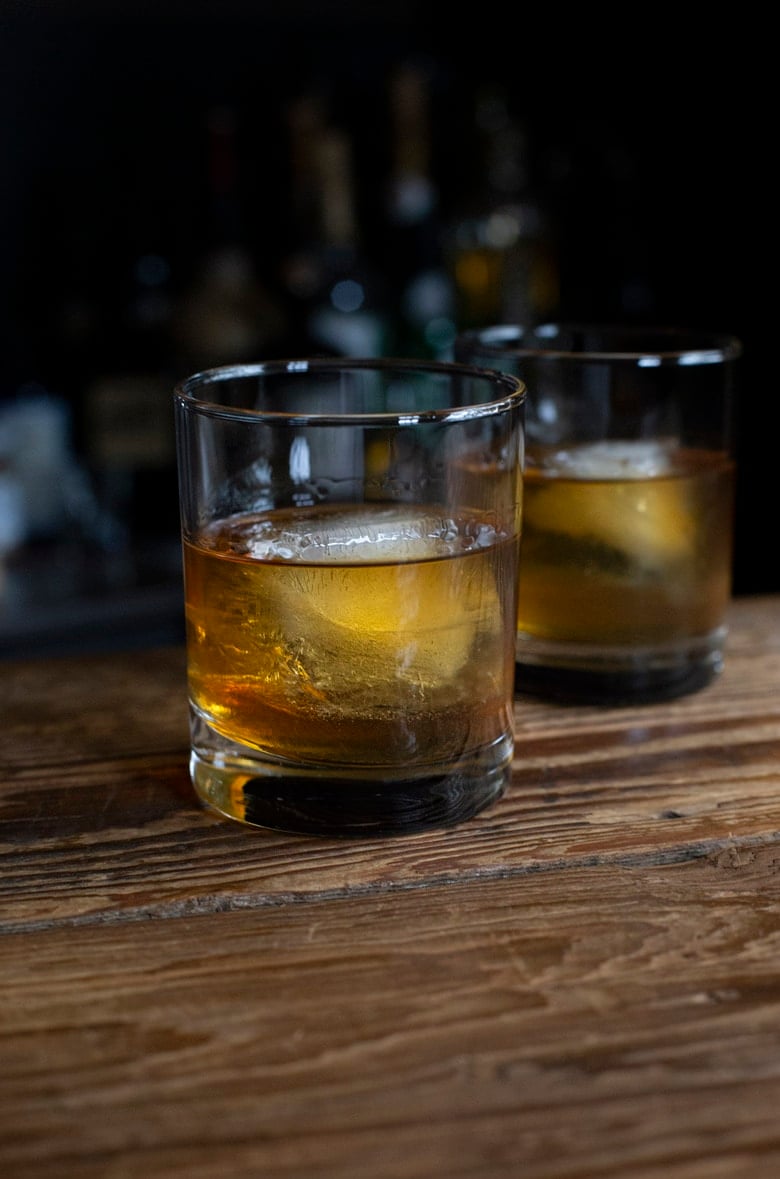 A classic Old Fashioned Cocktail in a rocks glass made with bourbon whiskey. 