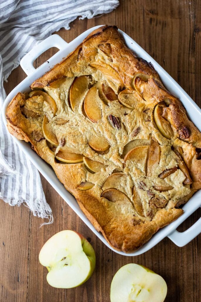 top view of baked apple pannekoeken recipe in casserole dish.