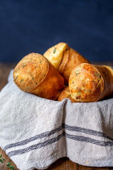 This recipe for Popovers takes just 15 minutes of hands-on time! Light and airy on the inside, golden and crispy on the outside, popovers are a beautiful addition to your holiday table or a simple, easy way to elevate weeknight dinners. The simple batter can be made ahead! Gluten-free adaptable. With a Video.