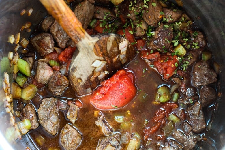 Get warm and cozy with this Instant Pot Beef Stew with Root Veggies- a hearty, comforting one-pot meal made in the pressure cooker, that is keto friendly, easy to make and full of depth and flavor. #beefstew #instantpotbeefstew #instantpot #bestbeefstew