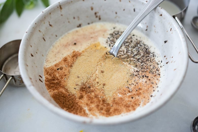 small bowl of cream with spices and a spoon. 