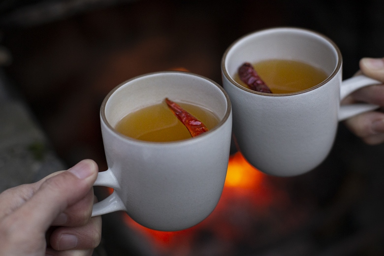 How to make a Hot Toddy at home, that we think is better than most of the professional versions you're likely to encounter! This recipe uses mezcal, lime juice & honey - but you can easily swap those out for the traditional whiskey with lemon - or nearly any other base spirit, citrus & spice combination that suits your tastes.  #hottoddy
