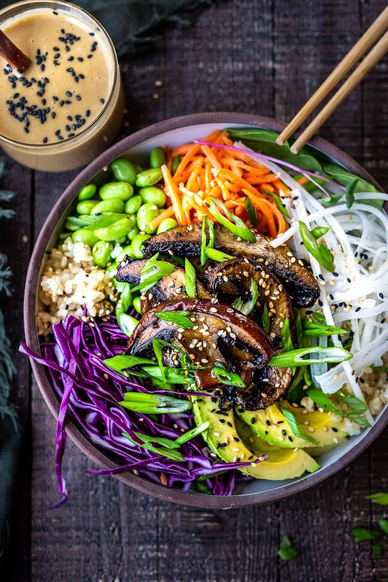 Our 25 BEST Vegan Buddha Bowls!| Our 25 BEST Vegan Buddha Bowls!| A flavorful Miso Mushroom Bowl with brown rice, avocado, cabbage, carrots, daikon, edamame and a Miso Ginger Dressing. Vegan and Gluten free. #bowl #veganbowl #vegandinner #mushroombowl