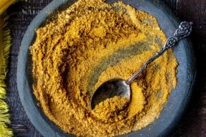 How to make homemade Yellow Curry Powder using spices you already have in your spice drawer. This mild Indian version is simple and easy and can be made with whole spices or ground spices. #currypowder #yellowcurrypowder #curry