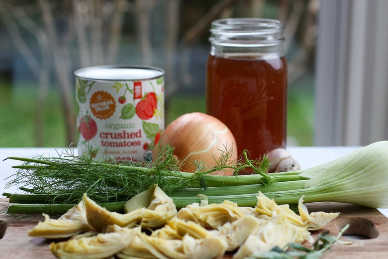 simple pantry ingredients in Tomato Artichoke soup - homemade broth, crushed tomatoes, onion, fennel, artichokes.
