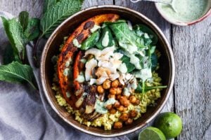 Here is one of our favorite millet recipes! Coconut Millet Bowls with berbere-spiced kabocha squash, chickpeas, shallots, and spinach, drizzled with a coconut lime sauce. Packed full of flavor this vegan, plant-based meal, is wholesome and nourishing!