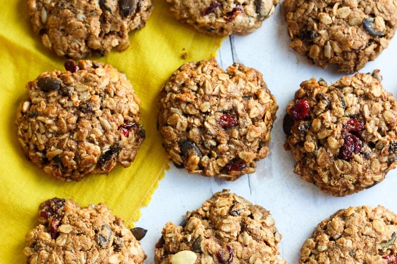 These healthy Breakfast Cookies can be made in under 30 minutes! They are chockfull of flavor and sustenance -filled with oats, seeds, spices and dried fruit they are vegan and deliciously addicting! Perfect for breakfast on the go. #breakfastcookie