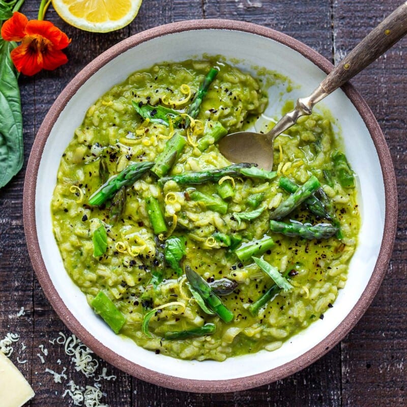 Lemony Asparagus Risotto with leeks and basil-light and creamy with vibrant color and flavor, perfect for spring! A tasty vegetarian meal, or beautiful base for fish, seafood or mushrooms! #asparagus #risotto #springrecipes