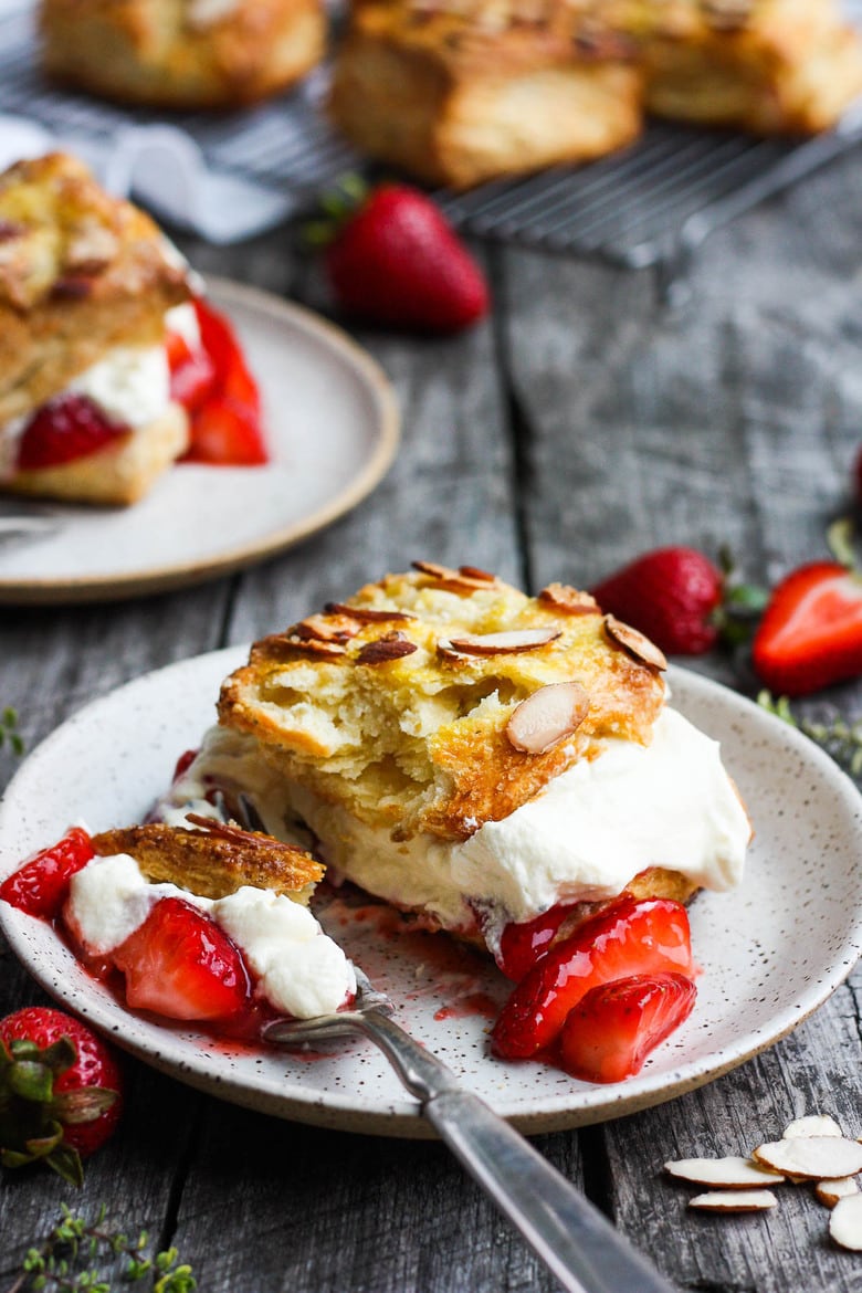 Homemade Strawberry Shortcake from Scratch with golden, flakey biscuits, jammy strawberry sauce, and yogurt whip cream. The perfect American dessert with a twist. This elevated version of the classic is subtly sweet and deeply satisfyinHomemade Strawberry Shortcake from Scratch with golden, flakey biscuits, jammy strawberry sauce, and yogurt whip cream. The perfect American dessert with a twist. This elevated version of the classic is subtly sweet and deeply satisfying. #strawberryshortcake. #strawberryshortcake