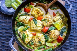 This recipe for Thai Fish Curry with Coconut Milk is brimming with seasonal veggies and bursting with delicious Thai flavors. A quick and easy dinner, perfect for both weeknights and special occasions. #thaifishcurry