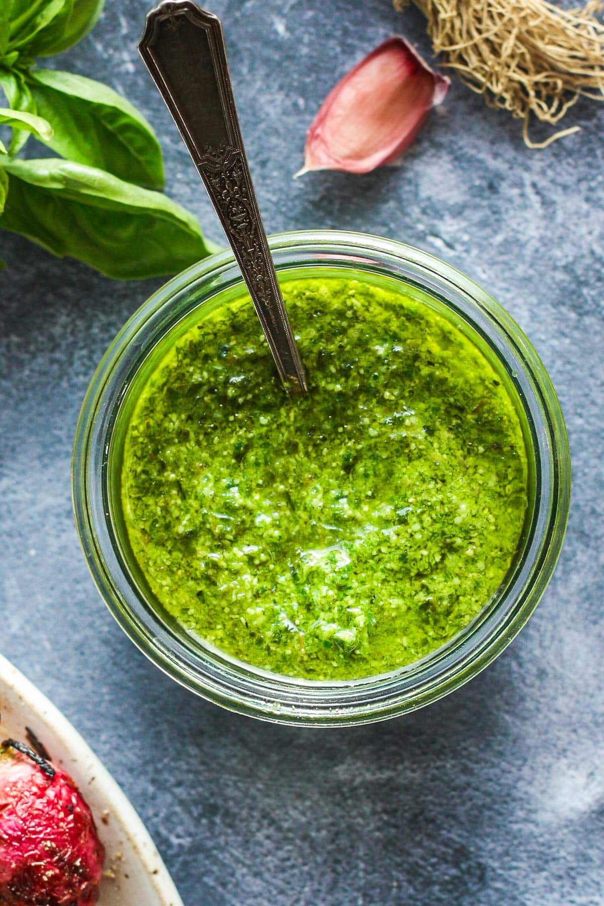 This fresh Basil Pesto recipe is brimming with bright and savory peppery basil goodness! This version is nut-free, made with nutritious hemp seeds and a splash of lemon.