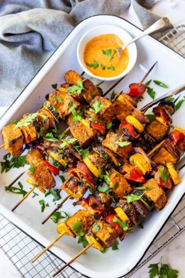 Grilled Veggie Skewers with fragrant Moroccan spices and a delcious harissa yogurt sauce. A tasty vegetarian meal that is vegan-adaptable.
