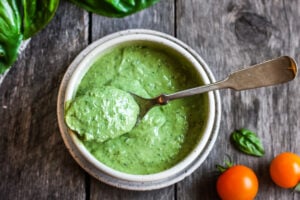 Creamy Pesto Dressing is a rich and vibrant compliment to so many dishes. Simple to make with just 5 ingredients. Perfect for pasta salads, sandwiches and dip. Vegan adaptable.