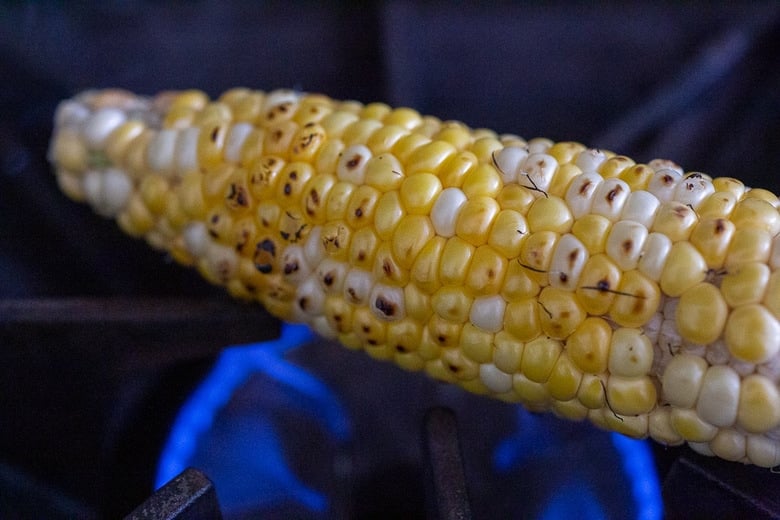 corn charring on a gas burner.