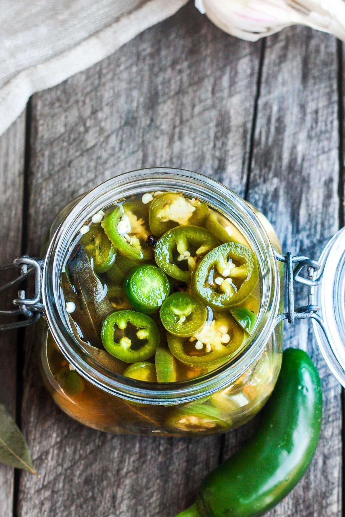 Pickled jalapeno peppers are easy to make in 15 minutes! They add a happy burst of flavor to tacos, burritos, nachos, quesadillas, sandwiches, burgers, salads, soups, and more. The uses are truly endless!