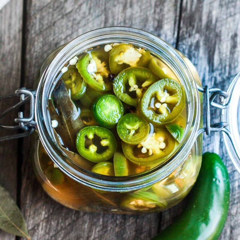 Pickled jalapeno peppers are easy to make in 15 minutes! They add a happy burst of flavor to tacos, burritos, nachos, quesadillas, sandwiches, burgers, salads, soups, and more. The uses are truly endless!