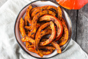 Tender and delicious Roasted Red Kuri Squash baked with an ancho chili powder -maple rub. A perfect fall and winter side dish. Easy to make with very little hands-on time. Vegan and Gluten-free.