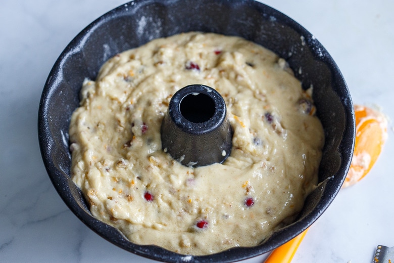 cranberry cake batter in bundt pan.