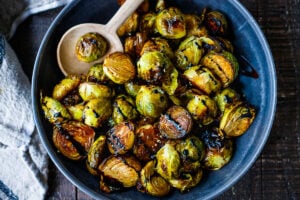 This Roasted Brussels Sprouts recipe yields perfectly tender insides with deliciously crispy edges. Easy to make in 30 mins.