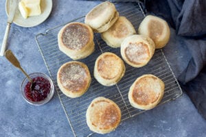How to make homemade Sourdough English Muffins using sourdough starter (no yeast!). They raise overnight and are cooked on the stovetop in the morning. Tender, delicious and easier to make than you might think! Vegan adaptable.