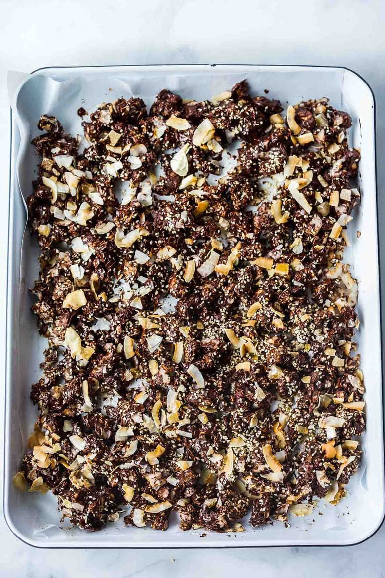 This Chocolate Bark is divinely delicious!  Made with chocolate chips, cashews, coconut, sesame seeds, and crystallized ginger, it is perfect for gifts and holiday gatherings.  Easy to make in under 30 minutes.  Adaptable, vegan, and gluten-free!