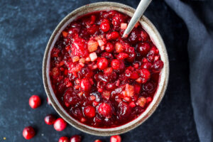 Orange Maple Cranberry Sauce with fresh apple is a bright and healthy addition to your holiday feast! Easy, fast, and can be made ahead. Maple-sweetened, and free of refined sugar, vegan and gluten-free! #cranberrysauce