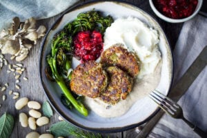 Sagey Leek and White Bean Patties are brimming with all the savory holiday flavors! Perfect for making ahead time. Serve them up with mashed potatoes, cranberry sauce and mushroom gravy for a satisfying vegan feast! Gluten-free adaptable.