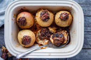 Healthy and delectable Baked Apples with Maple Syrup are filled with spiced toasty nuts, dates and dried cherries. Serve for dessert or brunch. No refined sugar, vegan and gluten-free!