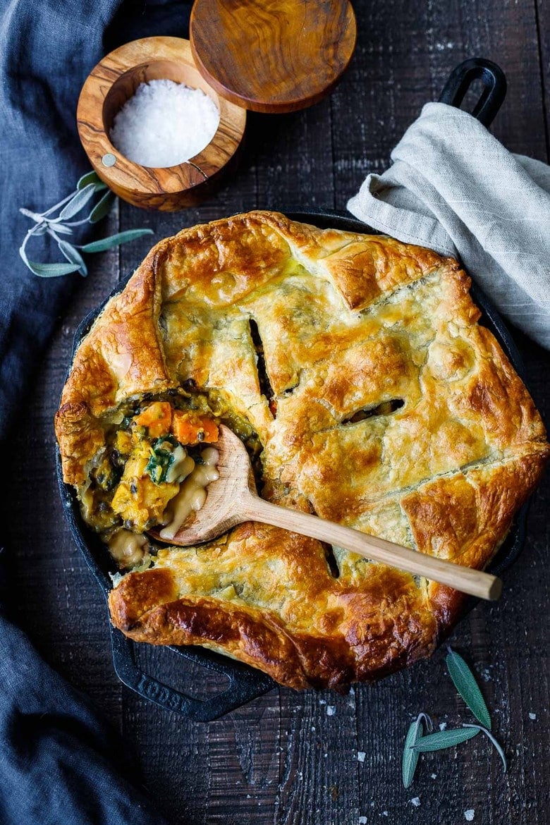 Vegan Pot Pie with Spring Vegetables is loaded with vibrant fresh veggies and flavorful herbs cooked in a delicious creamy lemon mustard sauce and topped with a flakey puff pastry crust.