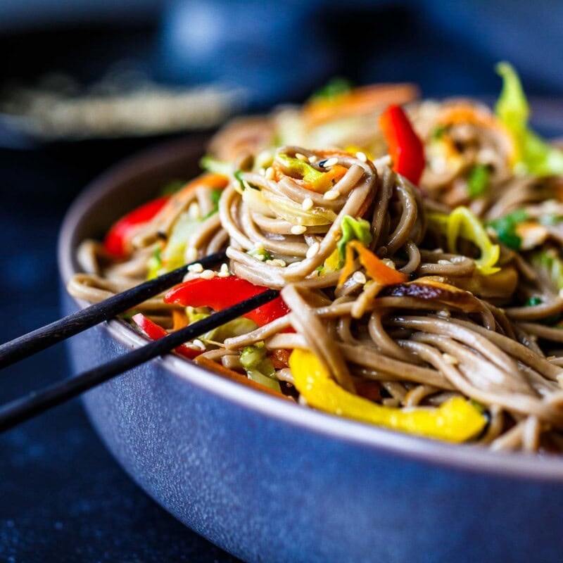 soba noodles in a bowl with chopsticks.