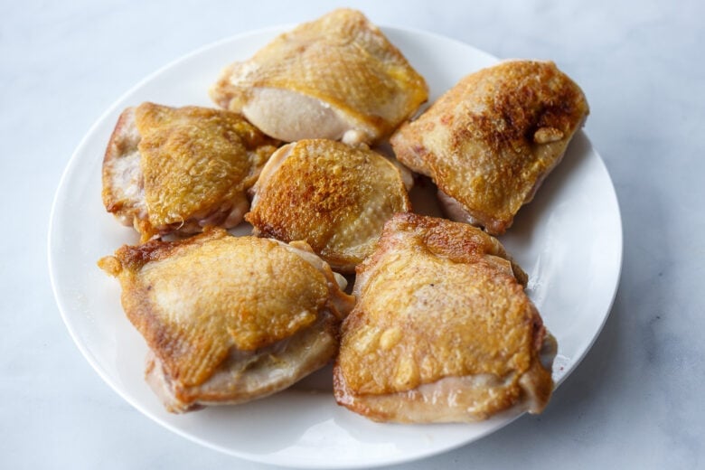 Seared chicken thigh for chicken cacciatore.