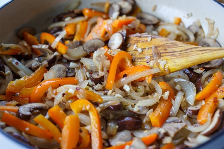 Sautéed onions, mushrooms, garlic, bell pepper and red pepper flakes for chicken cacciatore.