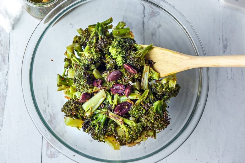 tossing salad together