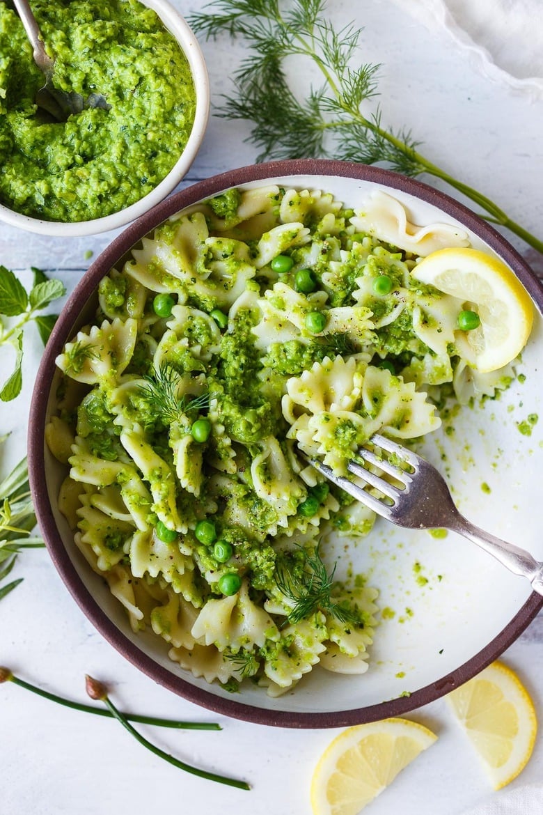 40 Vibrant Healthy Spring Recipes: Quick and easy to make, this Spring Pea Pesto is deliciously vibrant with fresh herby flavor. Perfect for a dip, spread or use as a sauce with pasta and buddha bowls. Vegan and gluten free!