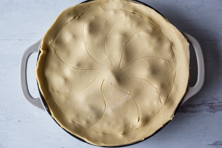 scored puff pastry on top of the filling. 