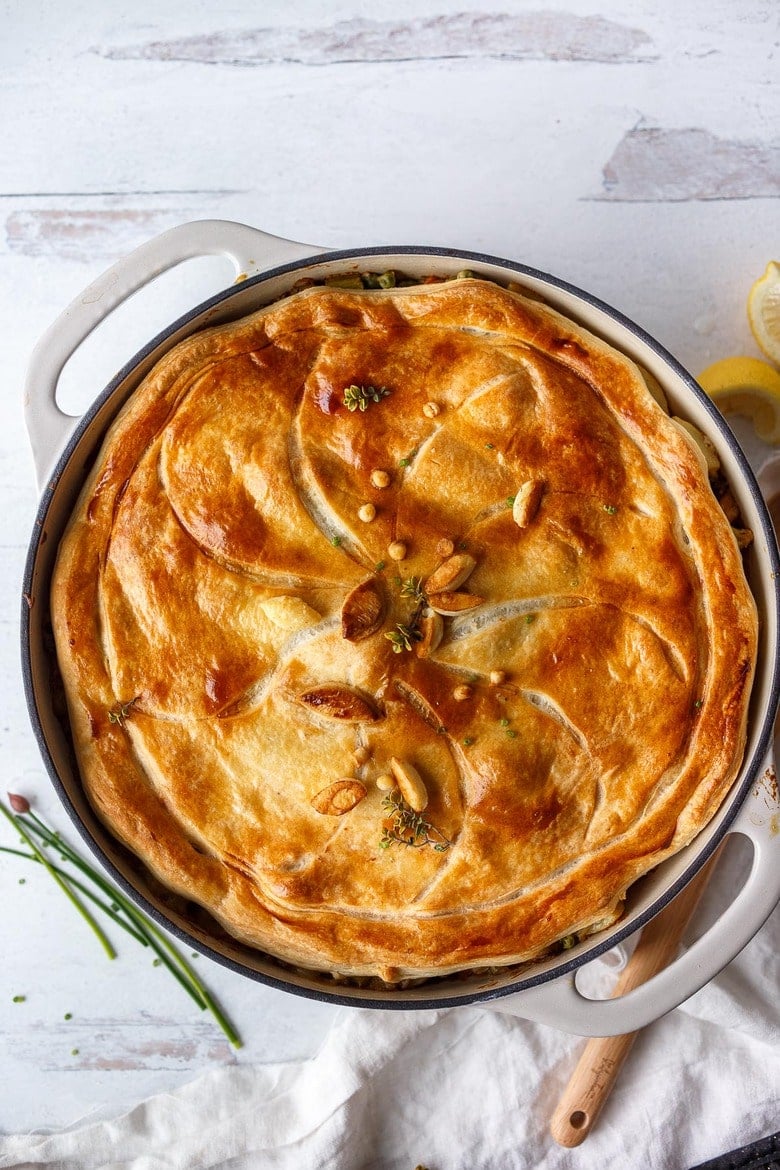 Golden brown pot pie filled with vegetables. 