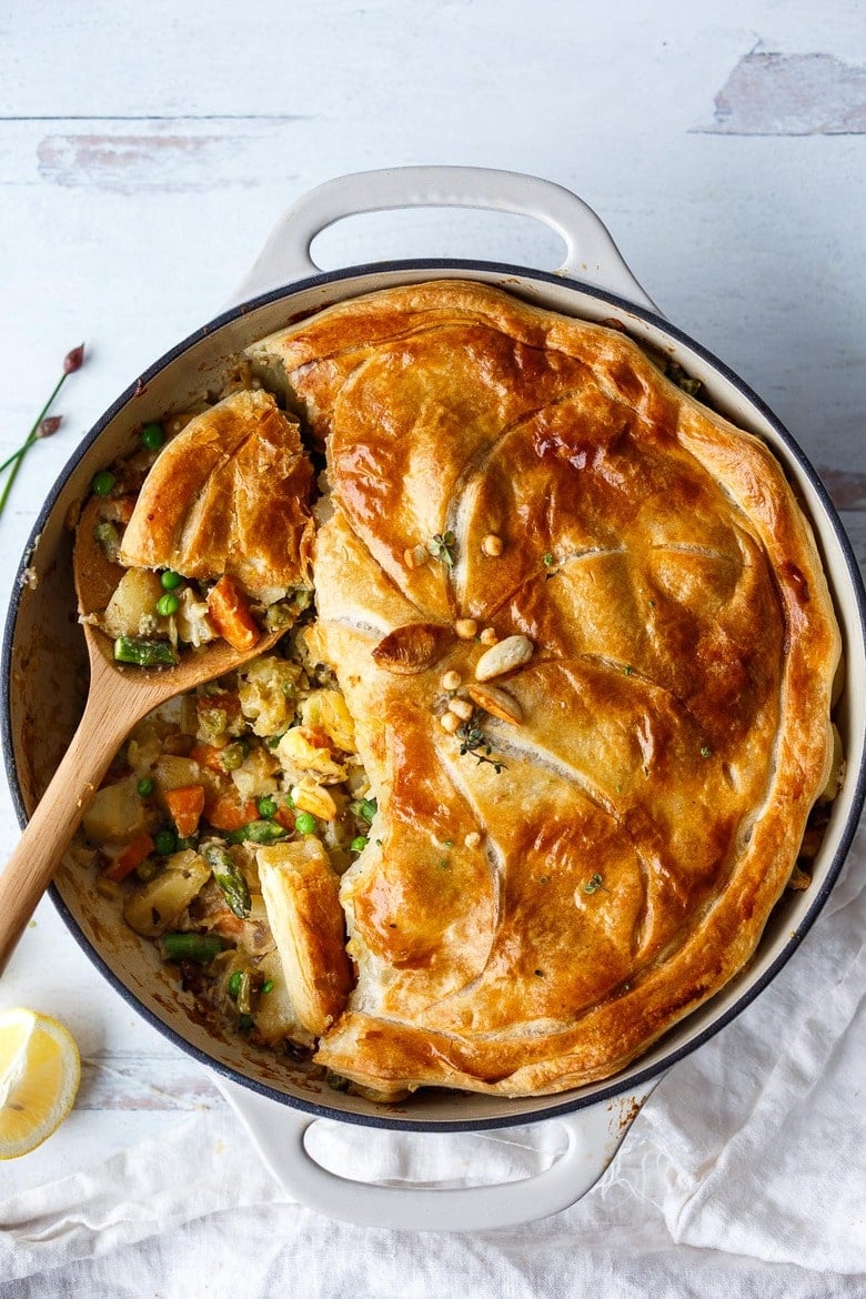 An easy vegetable pot pie made with fresh veggies and herbs with a creamy filling and beautiful golden puff pastry crust. Vegan and delicious! 
